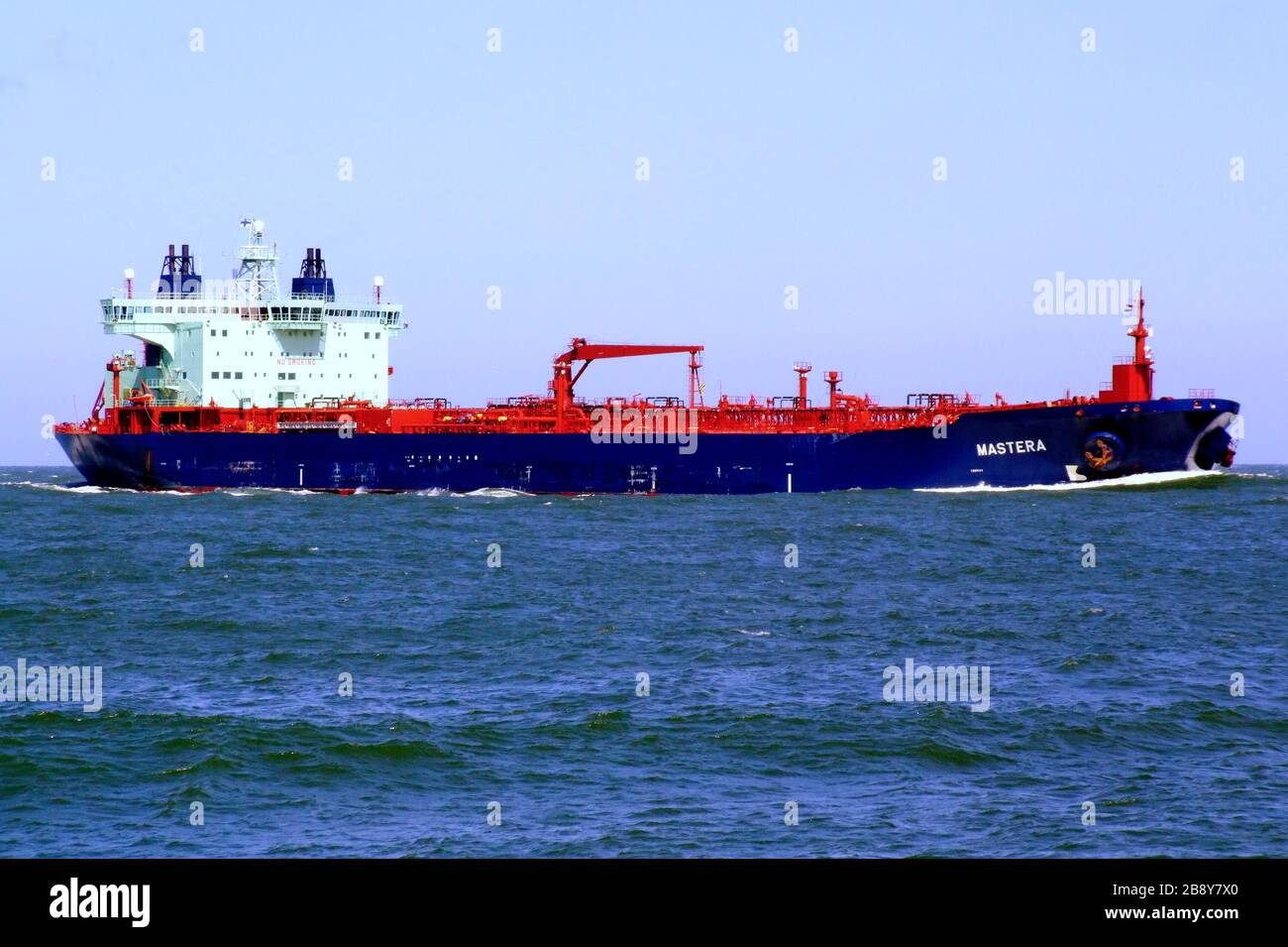 'English: MT Mastera in Rotterdam harbour. IMO Number:  9235892 MMSI Number: 230945000 Callsign: OJKE Length: 252 m Beam: 44 m Deutsch: Der dieselelektrisch angetriebene Tanker MASTERA, in Japan 2003 gebaut, hat einen Tiefgang von 15,30 m. Es ist mit 64259 BRZ; Tragfähigkeit: 106206 tdw vermessen und besitzt eine Doppelhülle. Für die Eisfahrt hat das Schiff auch eine Brücke nach achtern.; 20 June 2007; wp:en [1]; Alf van Beem; ' Stock Photo