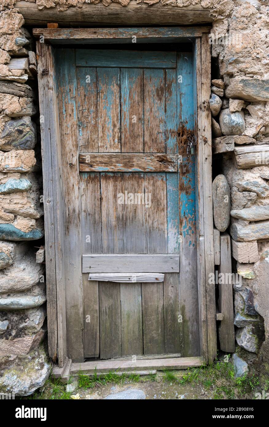 Old blue wooden door in Kalai Humb in Tajikistan. Stock Photo