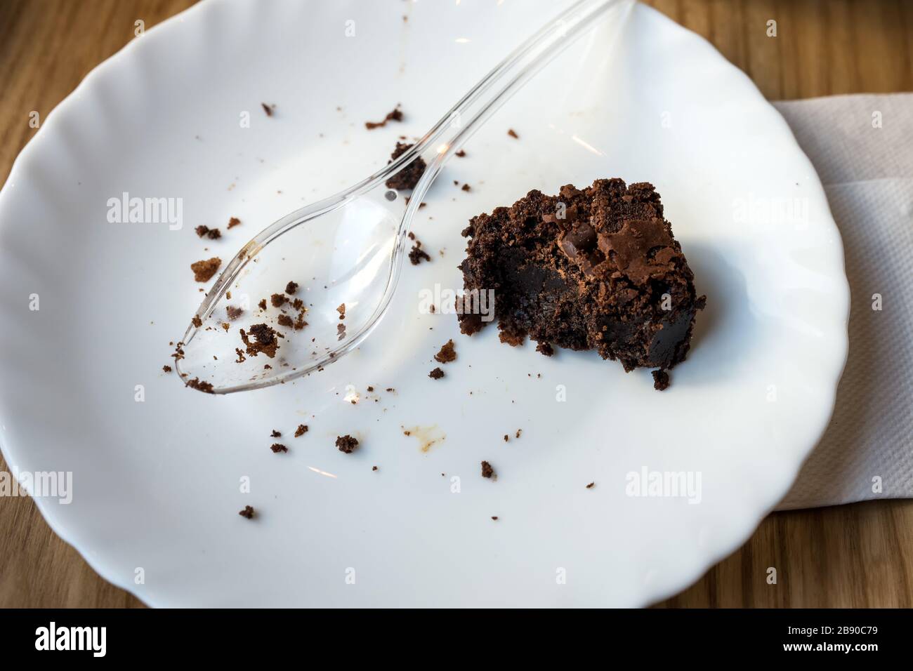 half eaten brownie on a plate selective focus copy space Stock Photo Alamy