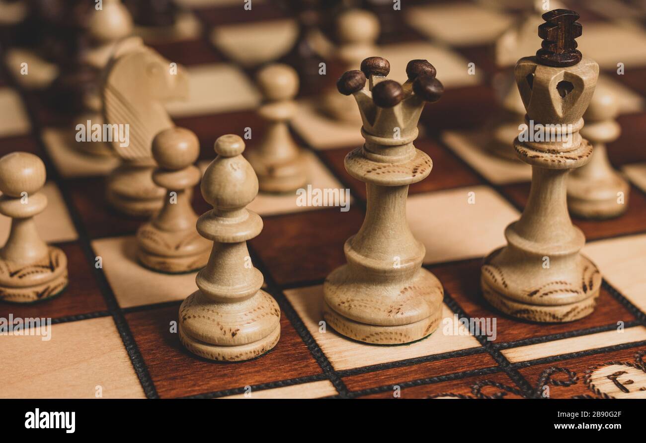 White chess bishop, queen and king protected by pawns. Royalty free stock photo. Stock Photo