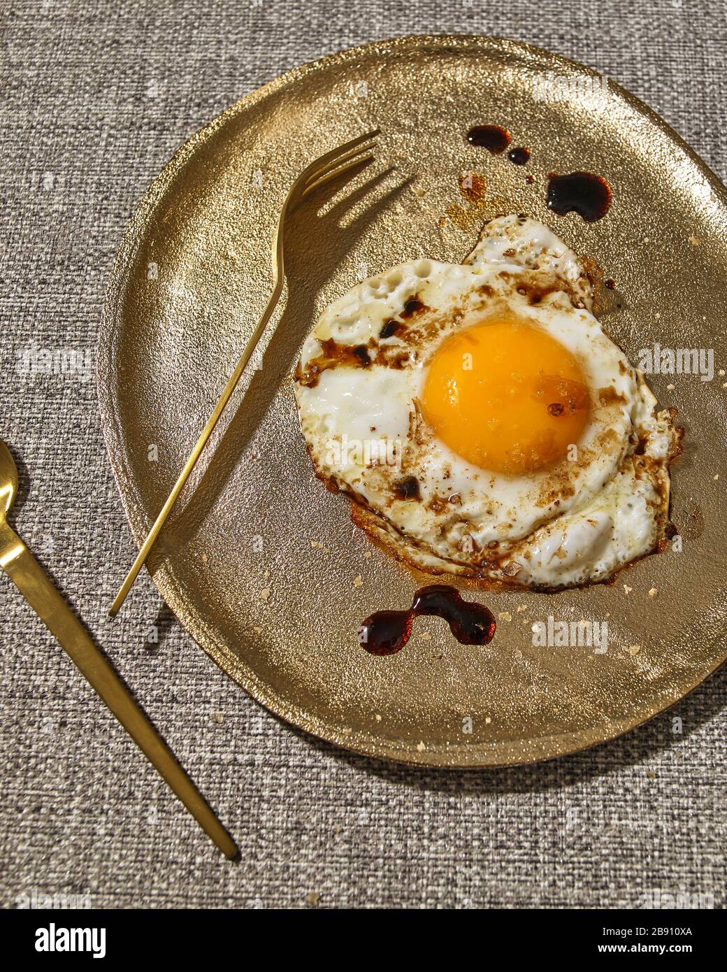 Fried egg with Balsamic vinegar and sea salt Stock Photo