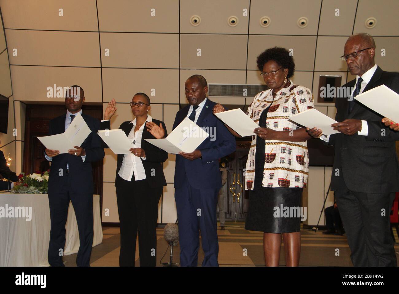 (200323) -- WINDHOEK, March 23, 2020 (Xinhua) -- Namibia's newly appointed ministers and deputy ministers take their oath of office at State House in Windhoek, Nambia, March 23, 2020. Namibian President Hage Geingob on Sunday appointed eight members of parliament and unveiled his new cabinet, local media reported citing a statement from the presidency. (Xinhua/Jacobina Mouton) Stock Photo