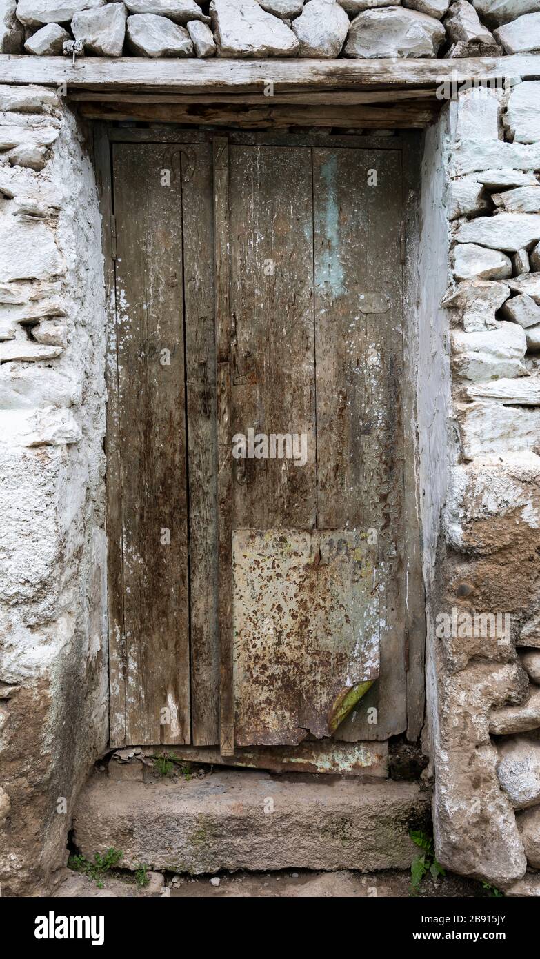 Old wooden white door in Kalai Humb in Tajikistan. Stock Photo