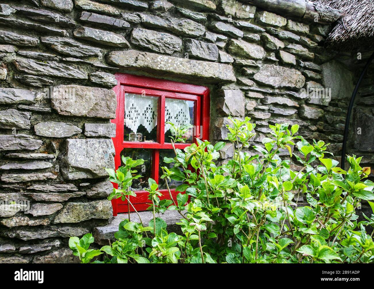 Historical Famine cottage of Molly Gallivan's, stone house with red