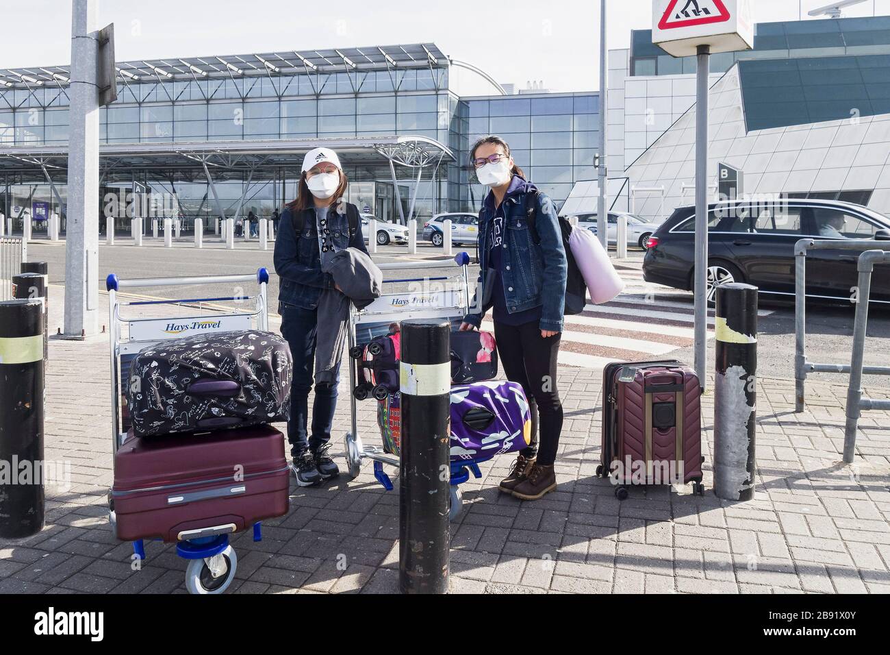 Newcastle uon Tyne, UK, 23rd March 2020. Newcastle University students don masks to fly home after courses suspended due to corvid-19 coronavirus. Joseph Gaul/alamy News Stock Photo