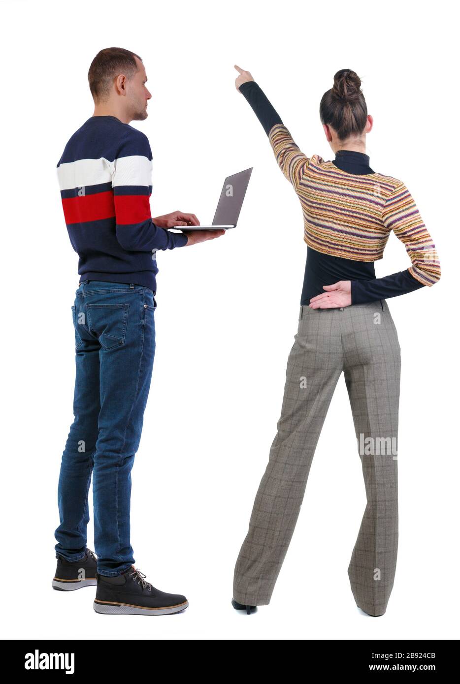 Back view of couple in sweater pointing. Rear view people collection ...