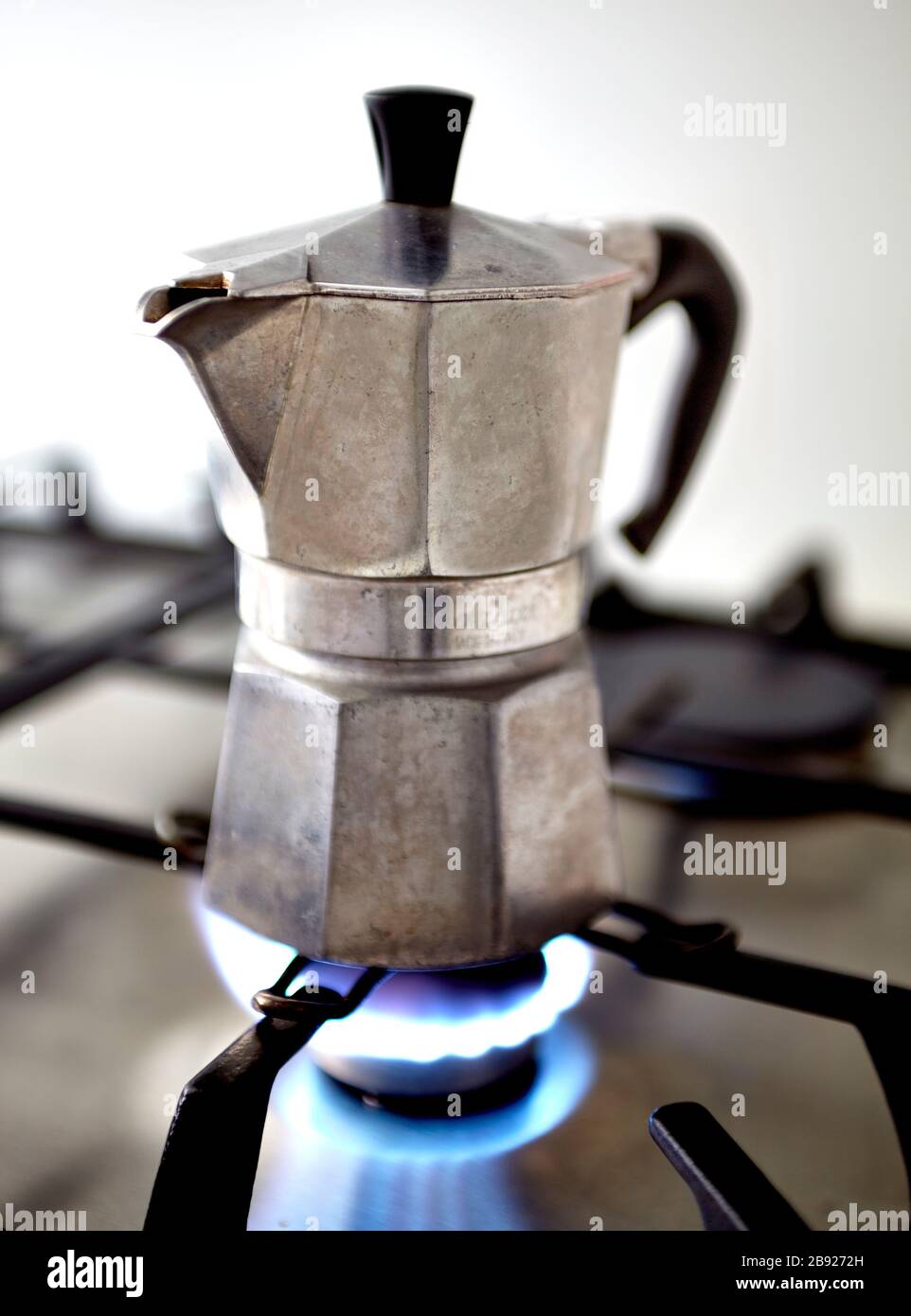 Bialetti Moka Express hob Espresso coffee maker on gas hob heating Stock Photo