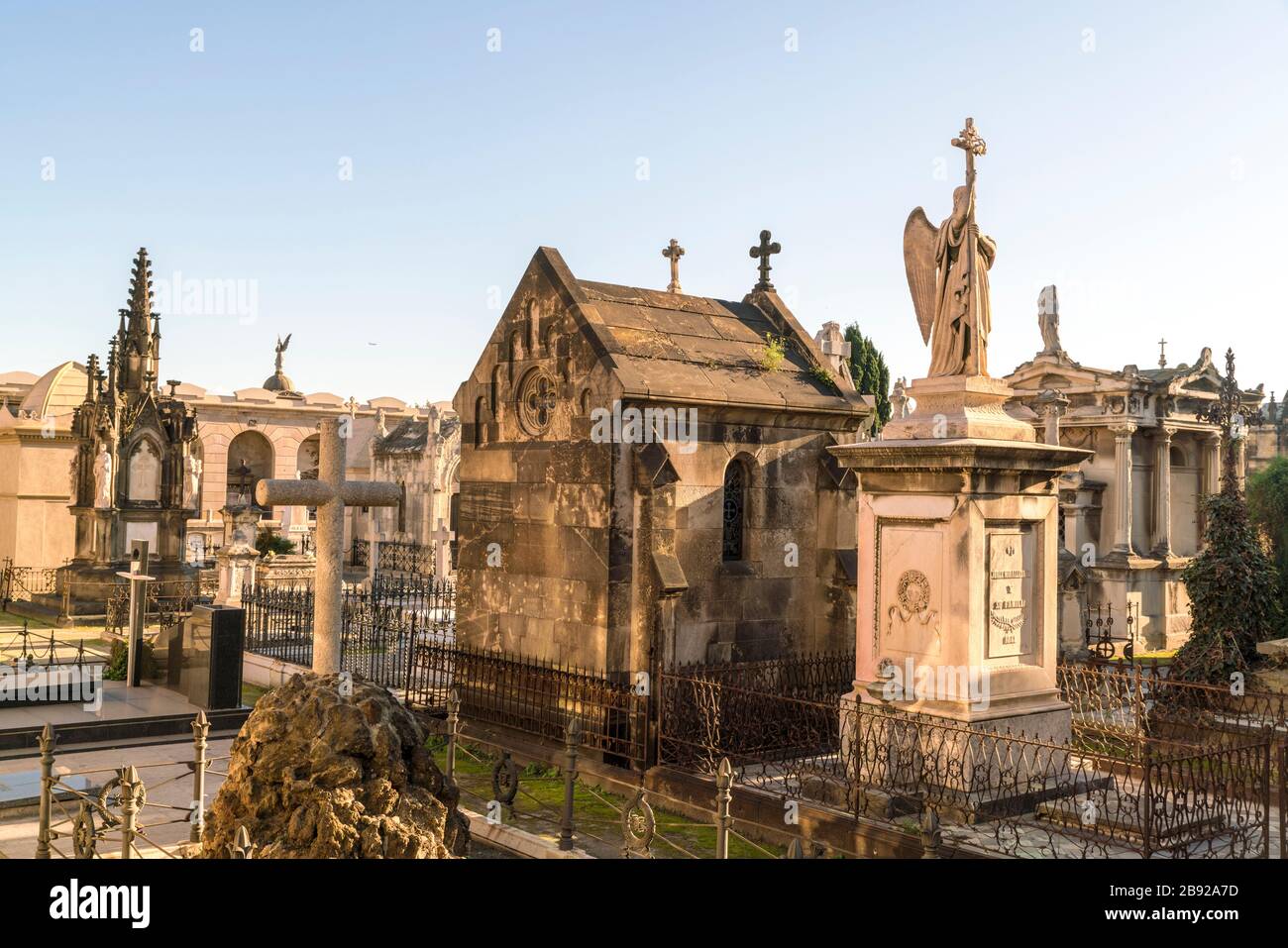 Historic Poblenou Cemetery with Angel statue and crosses in Barcelona Stock Photo