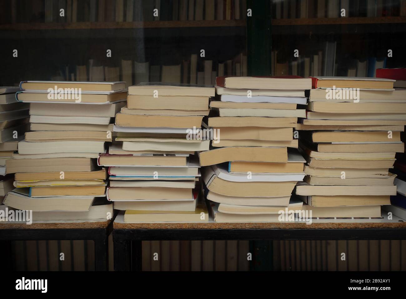Old used books for sale at antiquarian bookstore Stock Photo Alamy