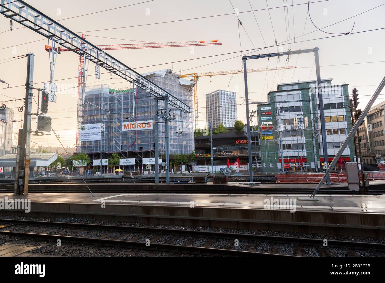 Tracks and overhead electric lines at the main train station (Hauptbahnhof) in Winterthur, Switzerland. Stock Photo