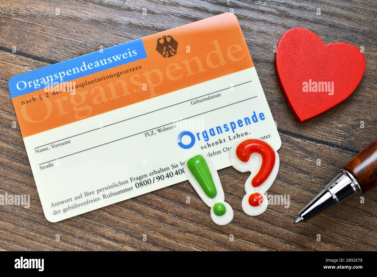 Organ donation identity card with heart, exclamation point and question