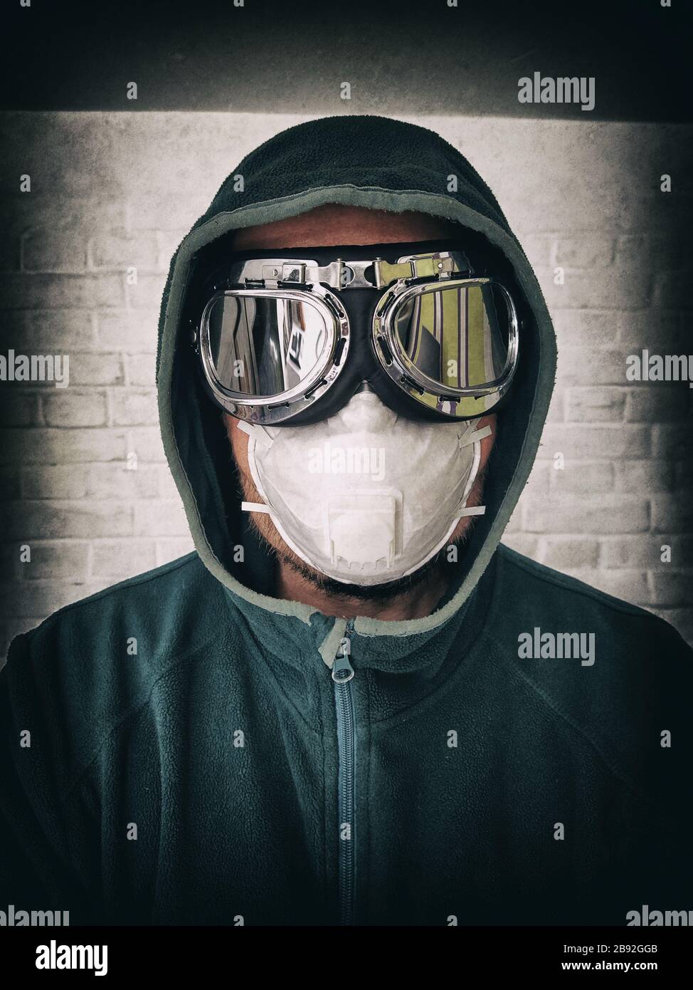 Portrait of a man in a protective mask and mirror glasses. Stylized ...