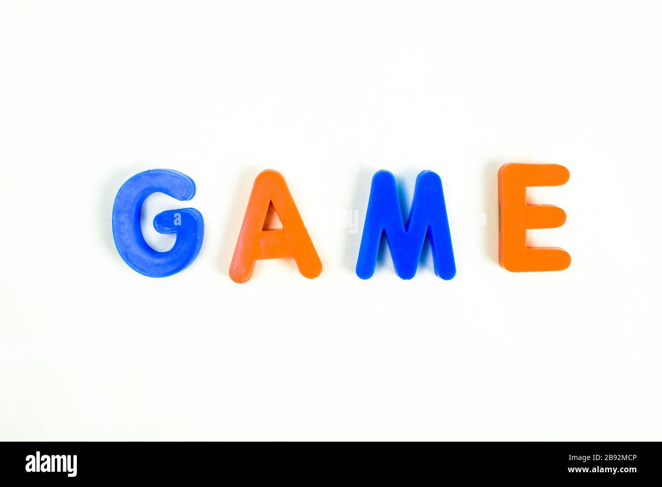 GAME written in various colored letter blocks on an isolated white background Stock Photo