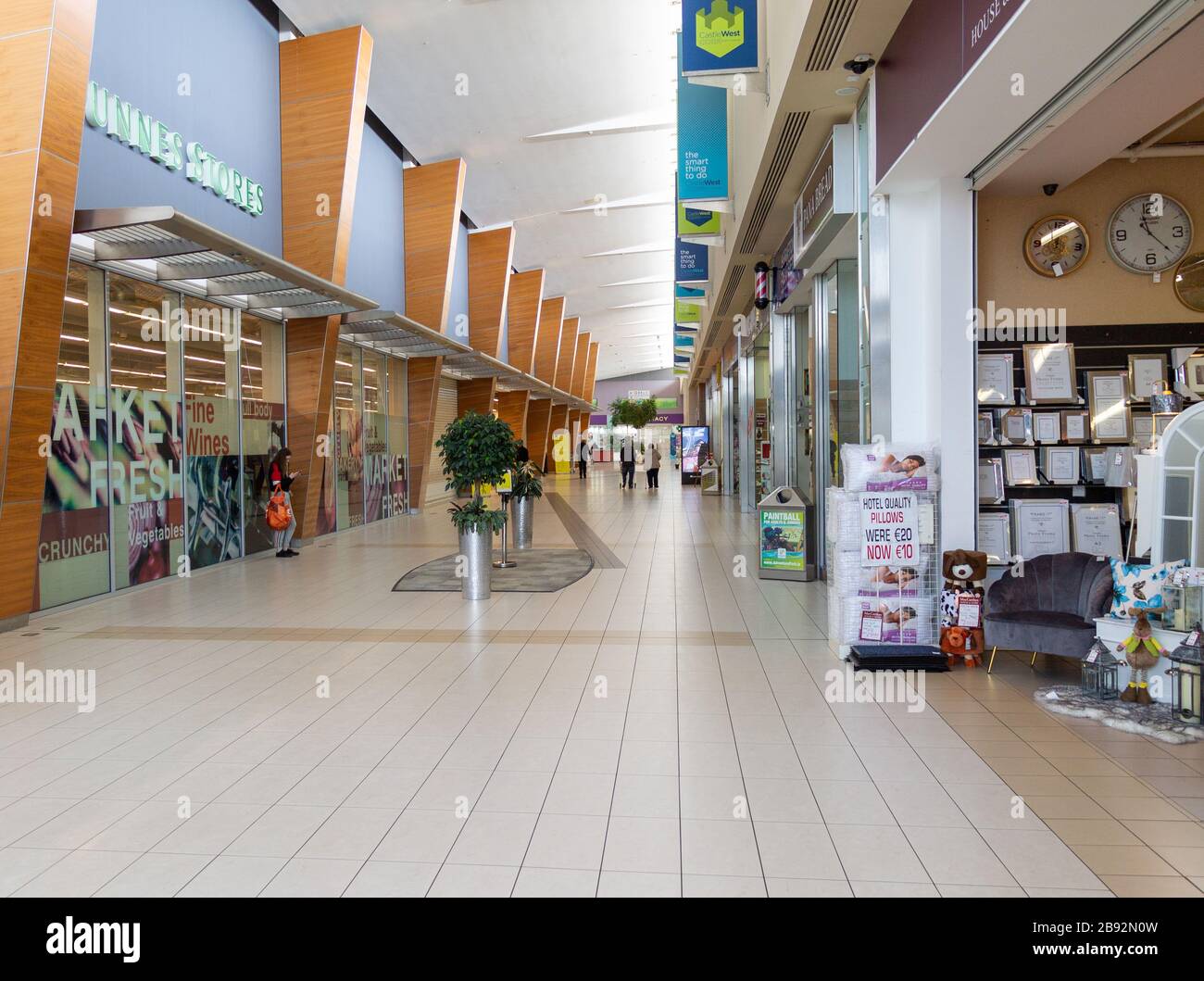 Ballincollig, West Cork, Ireland, 23rd March 2020. The normally busy Castle West Shopping Centre in Ballincollig should be packed with shoppers, but the Coronavirus is keeping people away leaving shops empty. Credit aphperspective/ Alamy Live News Stock Photo