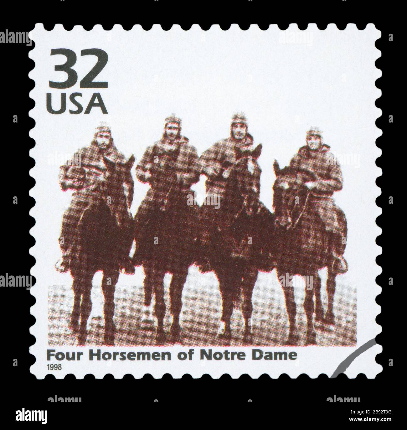UNITED STATES OF AMERICA - CIRCA 1998: a postage stamp printed in USA showing an image of four players of Notre Dame Fighting Irish football team, cir Stock Photo