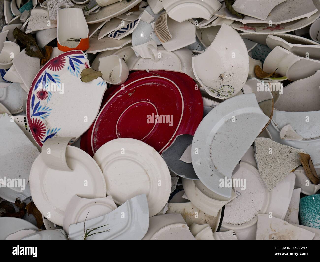 detail of a pile of broken china ready to be recycled and used as raw material for construction bricks Stock Photo