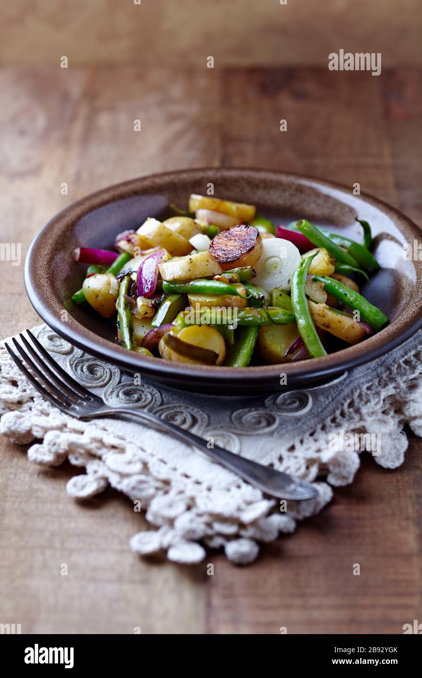 Oven roasted vegetables on rustic wooden background Stock Photo - Alamy