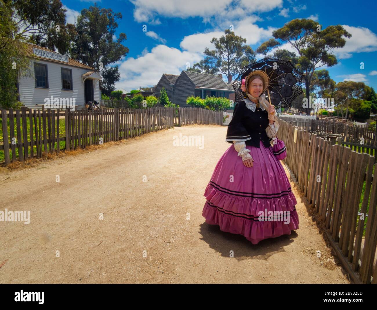 Lady wearing old fashion costume during the goldrush  tourist attraction in Sovereign Hill, Ballarat, Melbourne Stock Photo