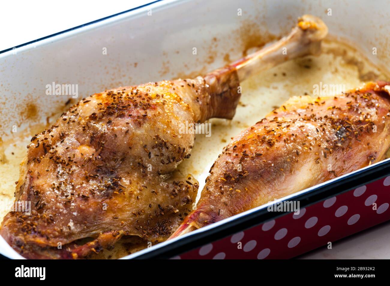 baked goose legs with cumin in frying pan Stock Photo Alamy