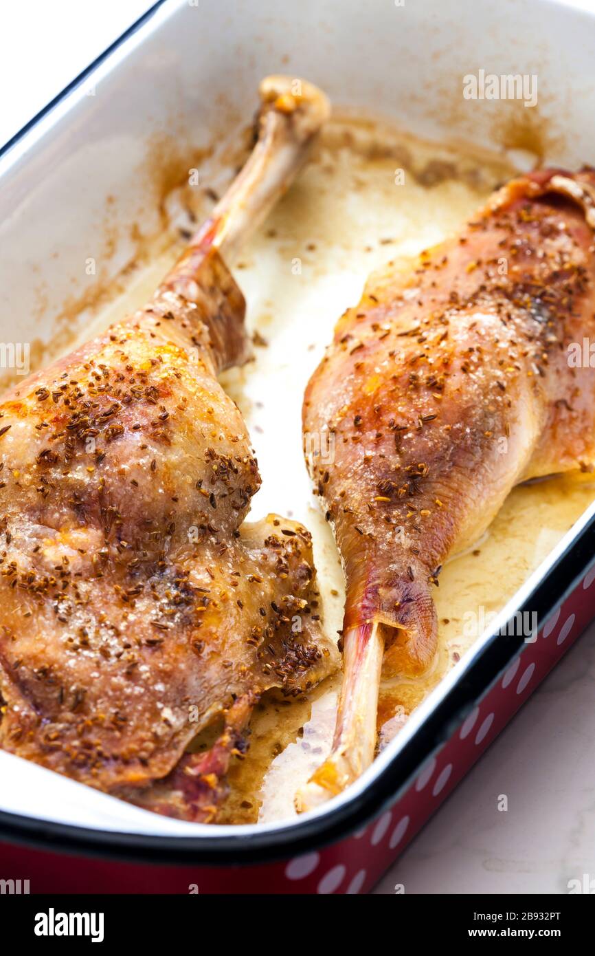 baked goose legs with cumin in frying pan Stock Photo Alamy