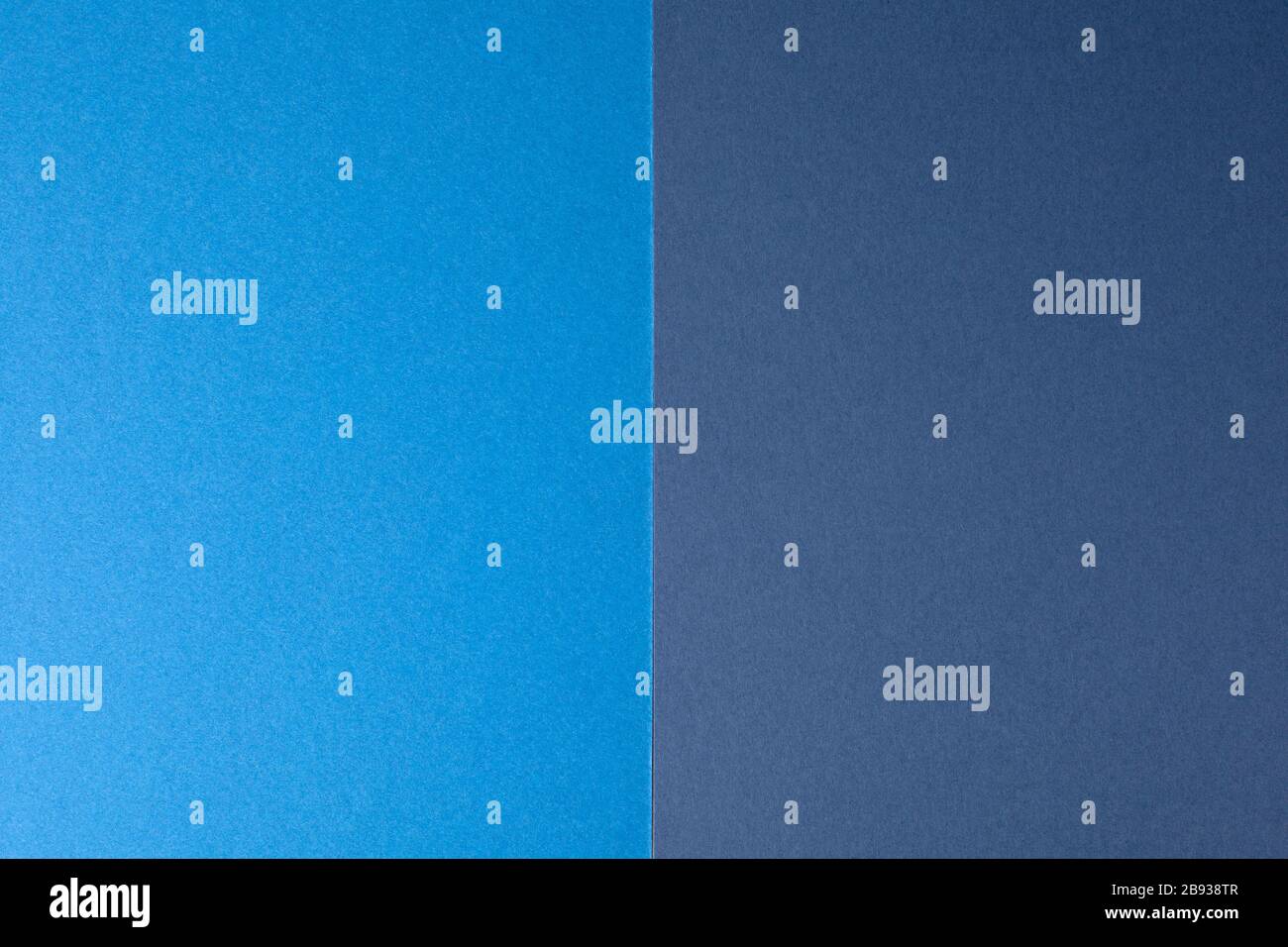 Light blue and dark blue paper background, copy space. Stock Photo