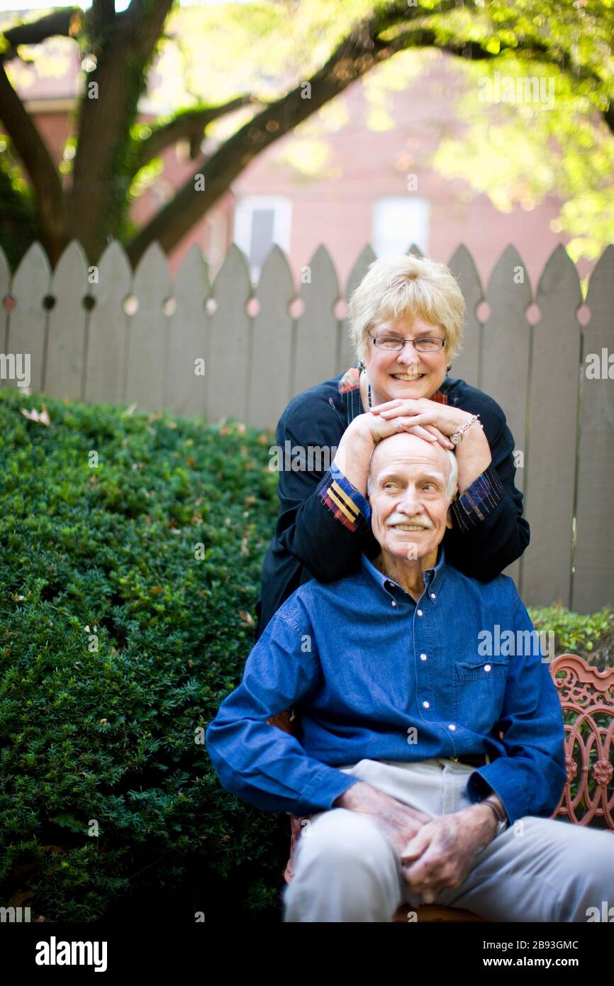 Woman resting on her husband's set Stock Photo