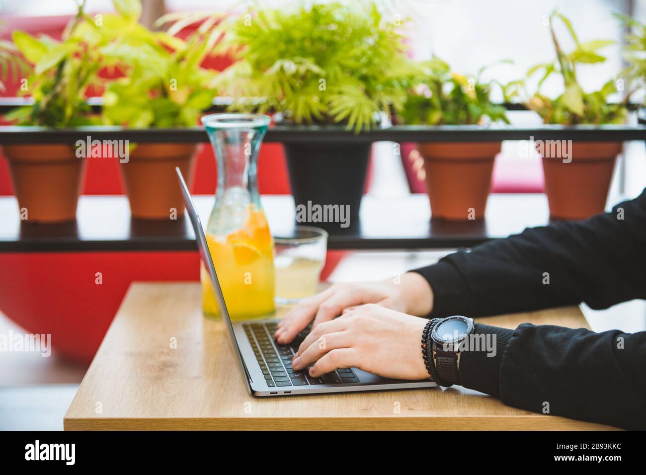 mans hands on laptop keyboard freelance concept Stock Photo