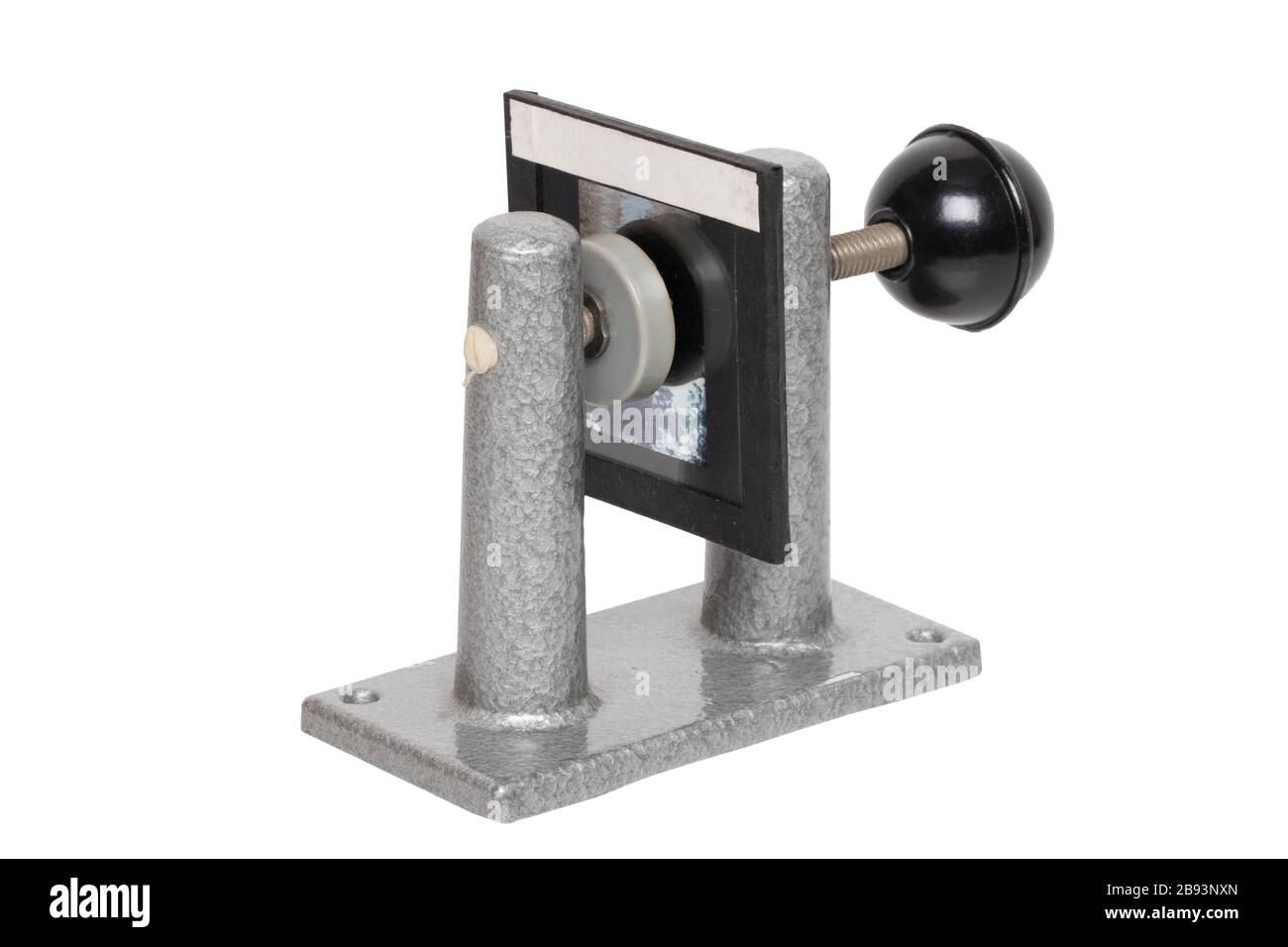 Close-up of a clamping device with a tensioned film slide to frame the slide pictures between two glasses. Entertainment last century to look holiday Stock Photo