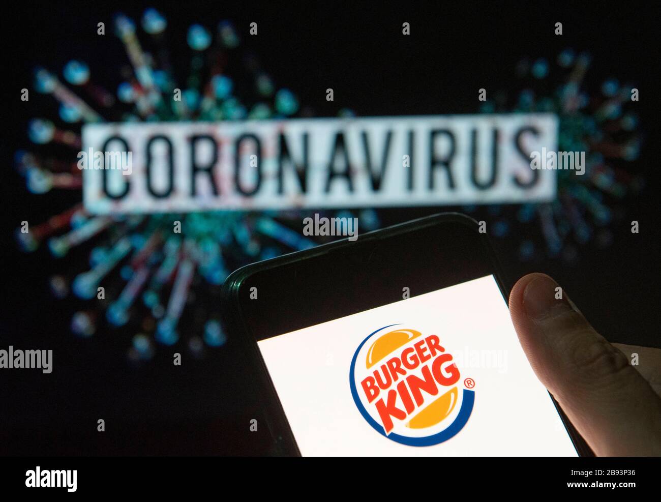 China. 20th Mar, 2020. In this photo illustration the American chain of hamburger fast food restaurants Burger King logo seen displayed on a smartphone with a computer model of the COVID-19 coronavirus on the background. Credit: Budrul Chukrut/SOPA Images/ZUMA Wire/Alamy Live News Stock Photo