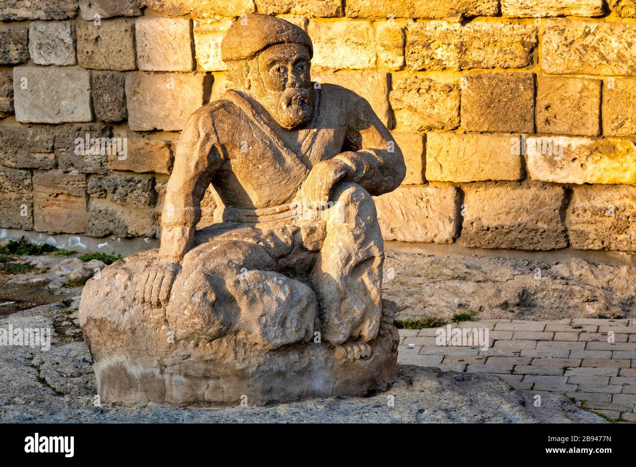 Statue in front of Maiden Tower, Baku, Azerbaijan Stock Photo