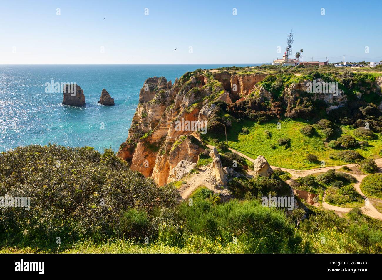 View of Lagos coastline in Portugal, Ponta da Piedade in the distance Stock Photo