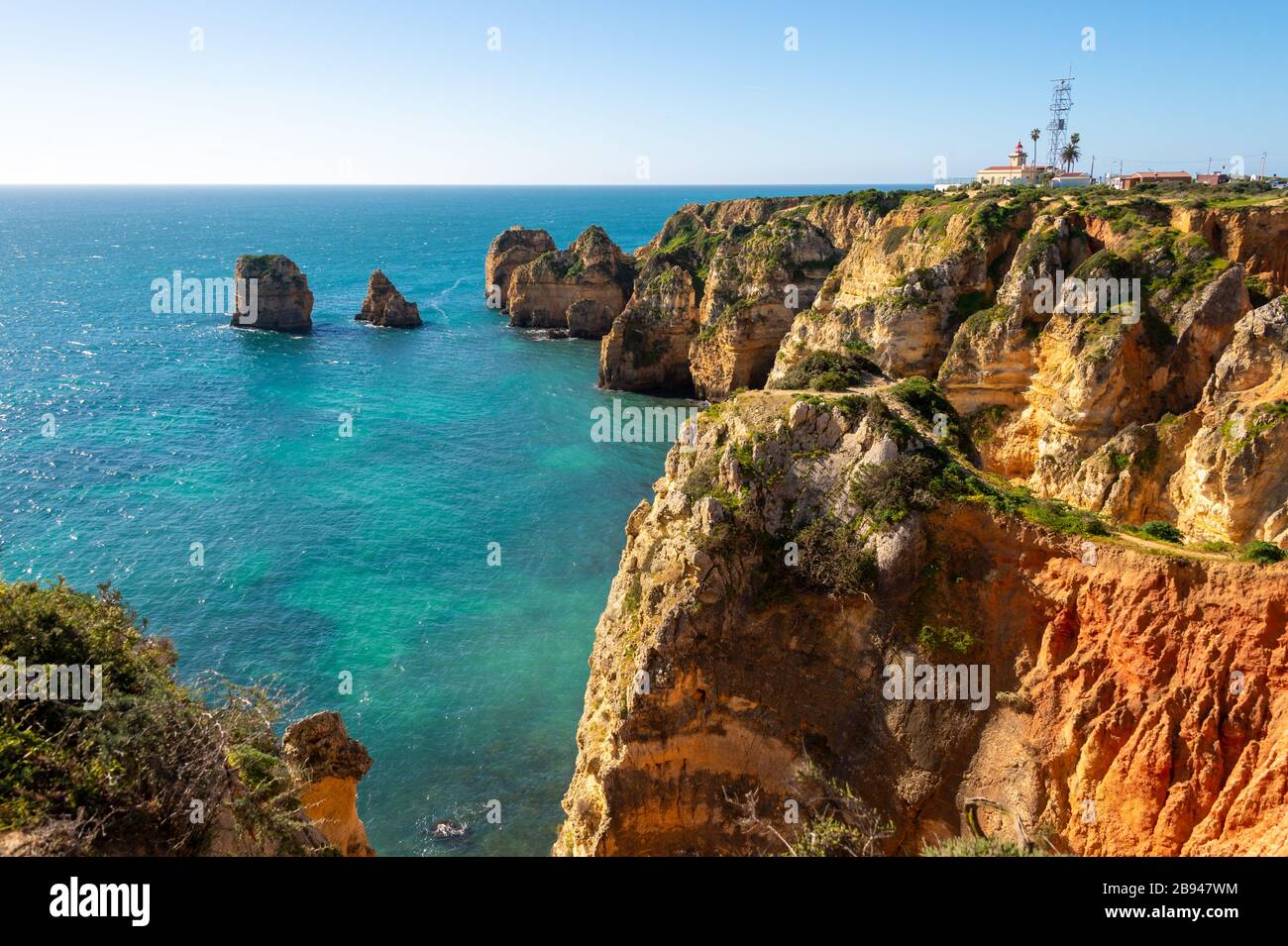 View of Lagos coastline in Portugal, Ponta da Piedade in the distance Stock Photo