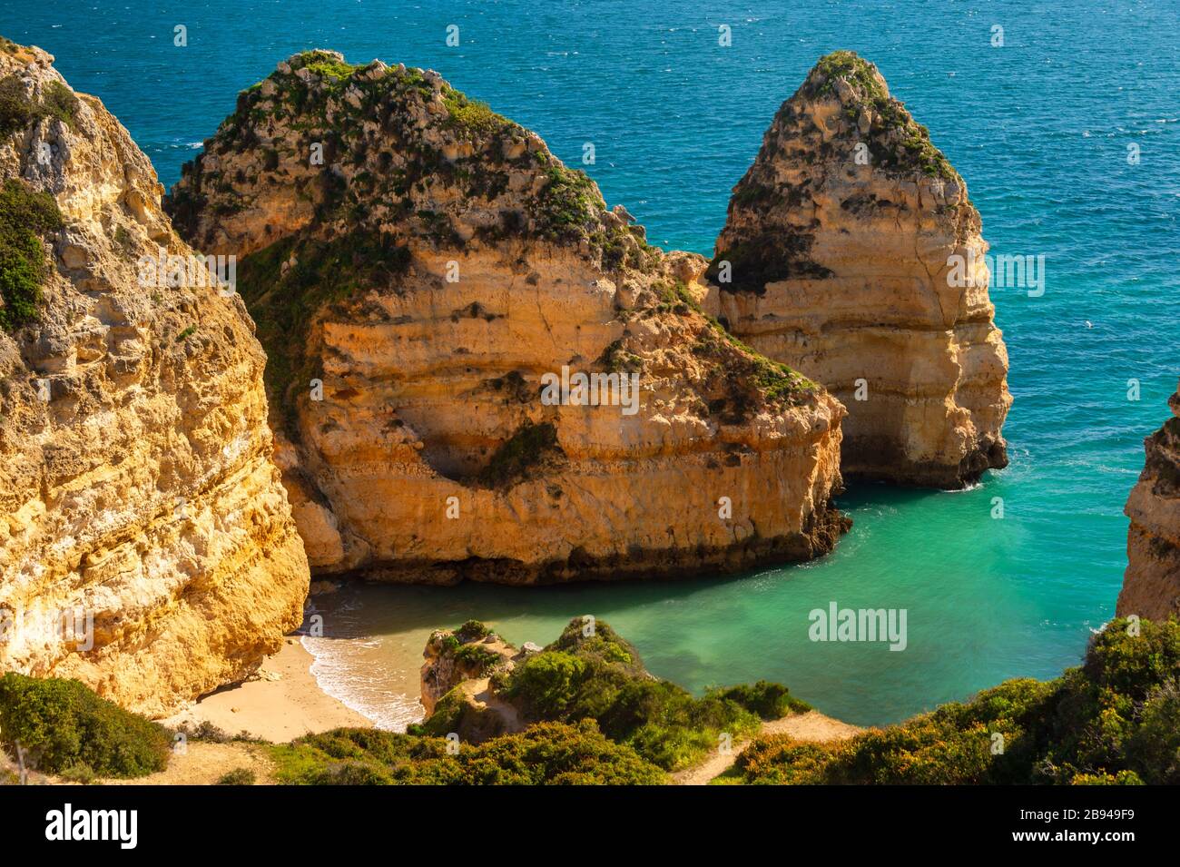 Empty beach and cliffs in Lagos, Portugal Stock Photo