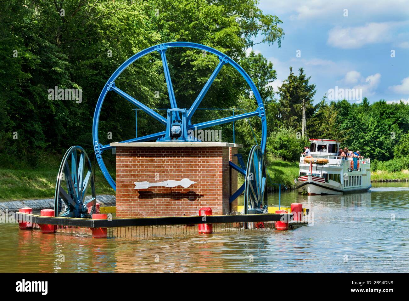 Mechanical equipment for transporting boats, boat moored to the shore on the Elblag Canal, Poland Stock Photo