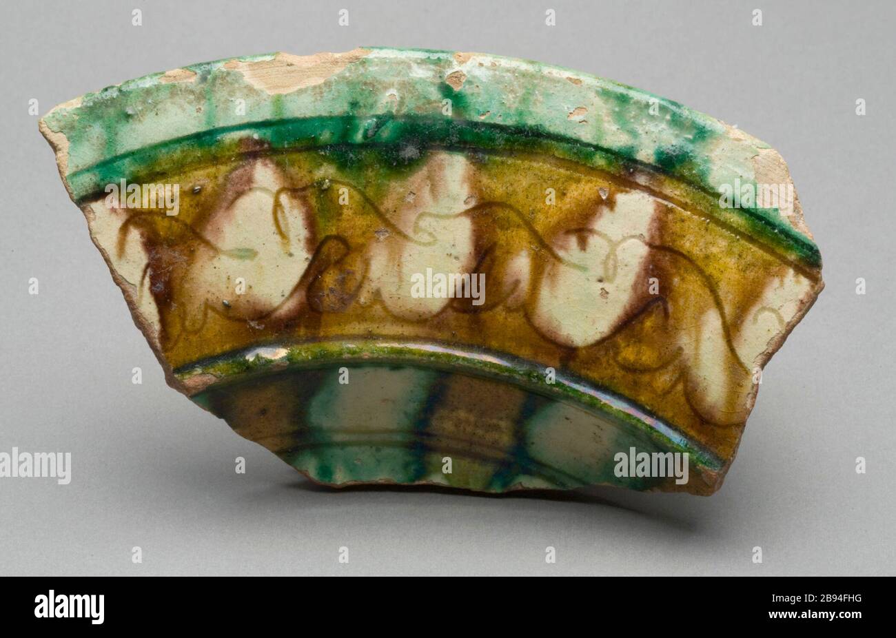 'Shard:  Section of Everted Rim; English:  Egypt, Faiyum, 10th century Fragments; shards Earthenware, sgraffito splash ware Gift of William Lillys in Memory of Dr. Edward L.B. Terrace (M.83.251.11) Islamic Art; 10th century date QS:P571,+950-00-00T00:00:00Z/7; ' Stock Photo