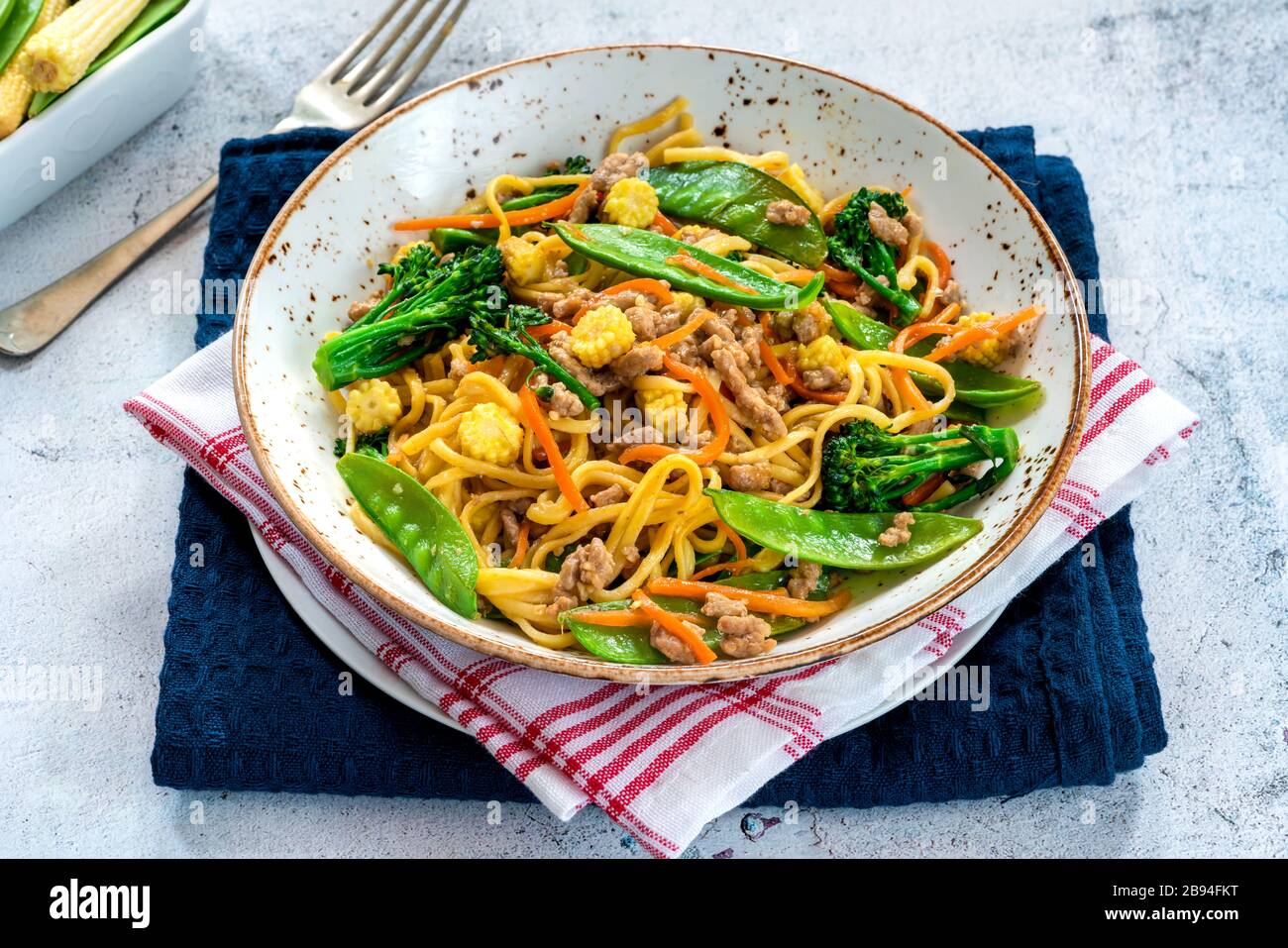 Pork noodle stir-fry with vegetables Stock Photo - Alamy