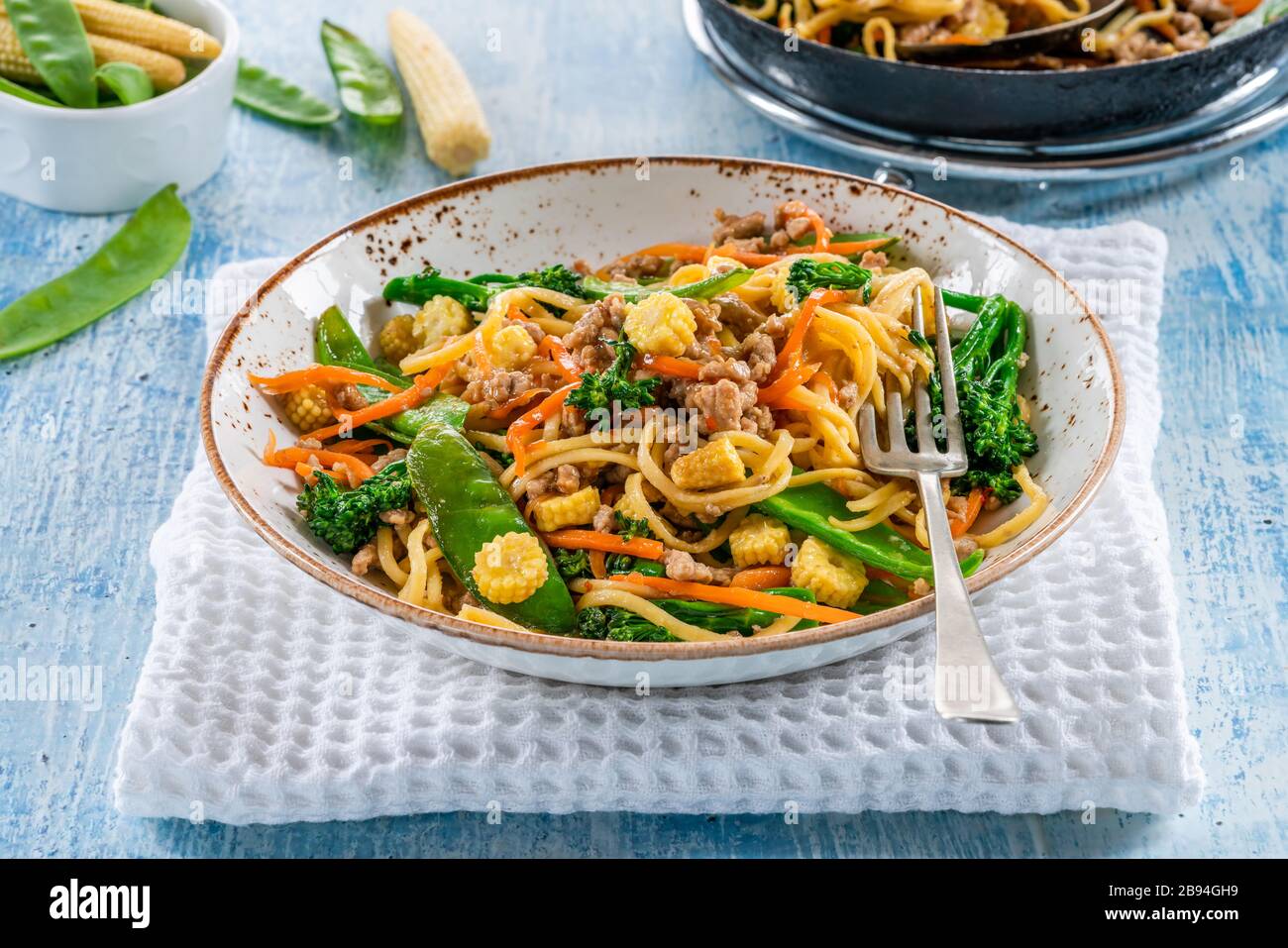 Pork noodle stir-fry with vegetables Stock Photo - Alamy