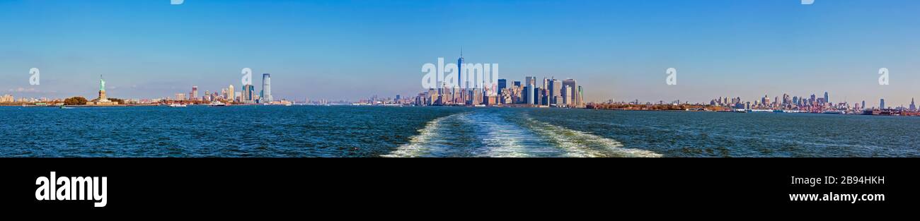 Lower Manhattan seen from New York Bay. The tall building is One World Trade Center, also known as 1 World Trade Center, 1 WTC or Freedom Tower. New Y Stock Photo