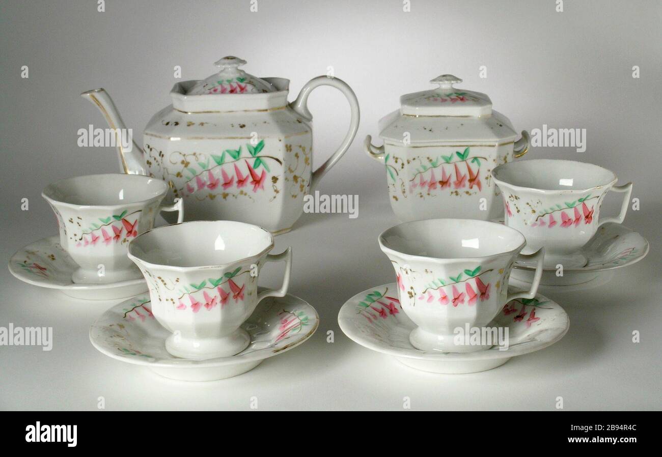"Tea Set; English: United States, circa 1828-1834 Furnishings; Serviceware Porcelain, painted a-b) Teapot: 6 1/4 x 9 3/4 x 4 3/4 in. (15.88 x 24.77 x 12.07 cm); c-d) Sugarbox: 5 1/2 x 5 3/4 x 3 3/4 in. (13.97 x 14.61 x 9.53 cm); e-l) Cup: 2 7/8 x 4 1/4 x 3 5/8 in. (7.3 x 10.8 x 9.21 cm) each; Saucer height: 5/8 in. (1.59 cm) each; Saucer diameter: 5 3/4 in. (14.61 cm) each Gift of Mr. and Mrs. Robert L. Grim (M.2000.101.1a-l) Decorative Arts and Design; between circa 1828 and circa 1834 date QS:P571,+1850-00-00T00:00:00Z/7,P1319,+1828-00-00T00:00:00Z/9,P1326,+1834-00-00T00:00:00Z/9,P1480,Q5 Stock Photo