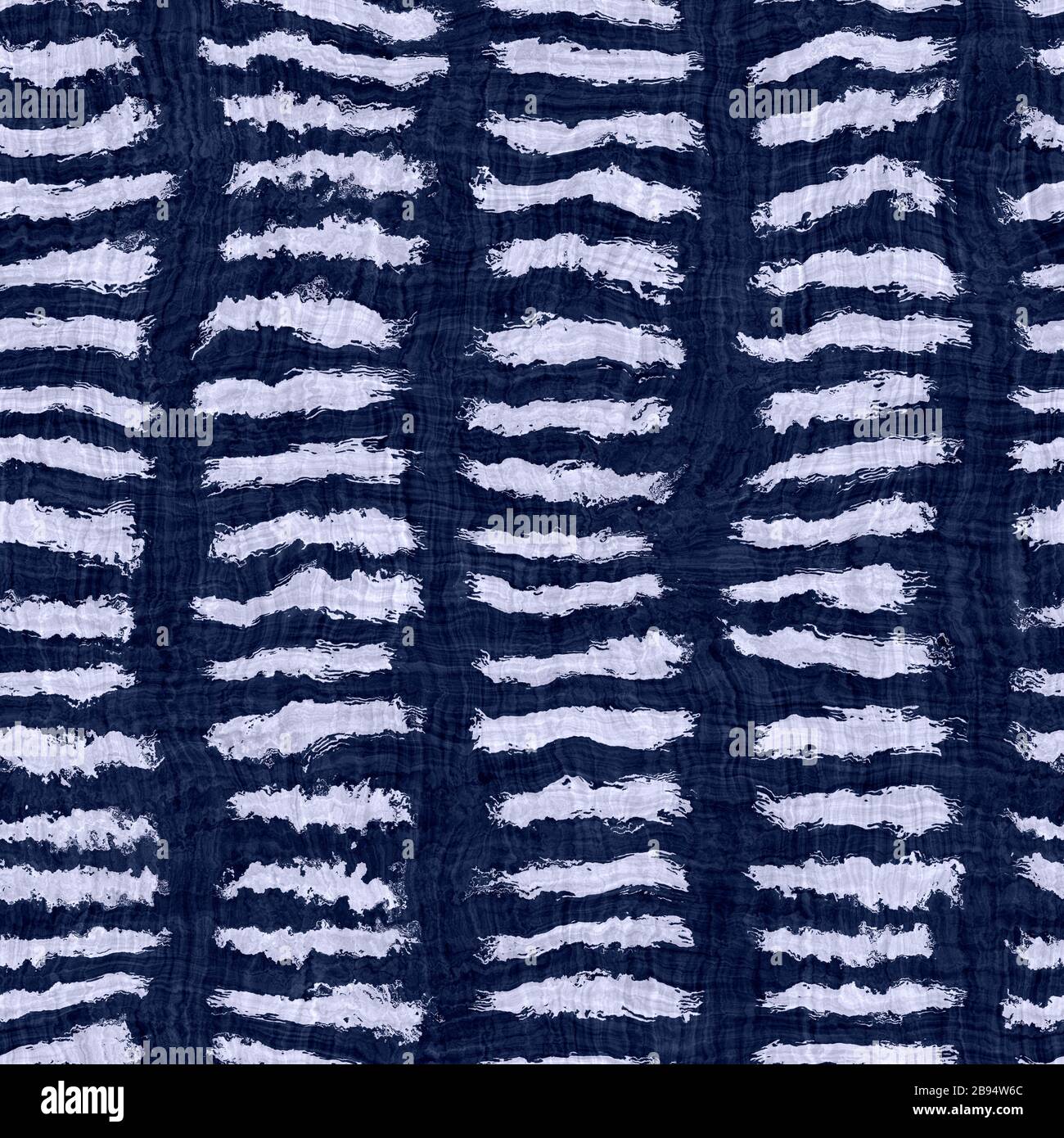 Indigo blue wax resist dyed broken stripe texture background. Seamless