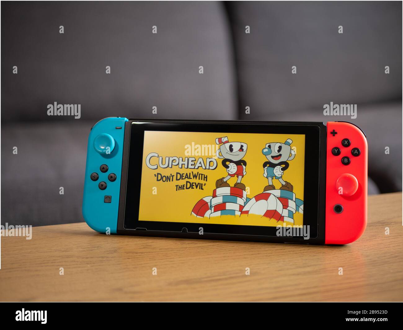 Nintendo Switch And Small Nintendo Switch Lite Comparison Of Two Handheld  Game Consoles Stock Photo - Download Image Now - iStock