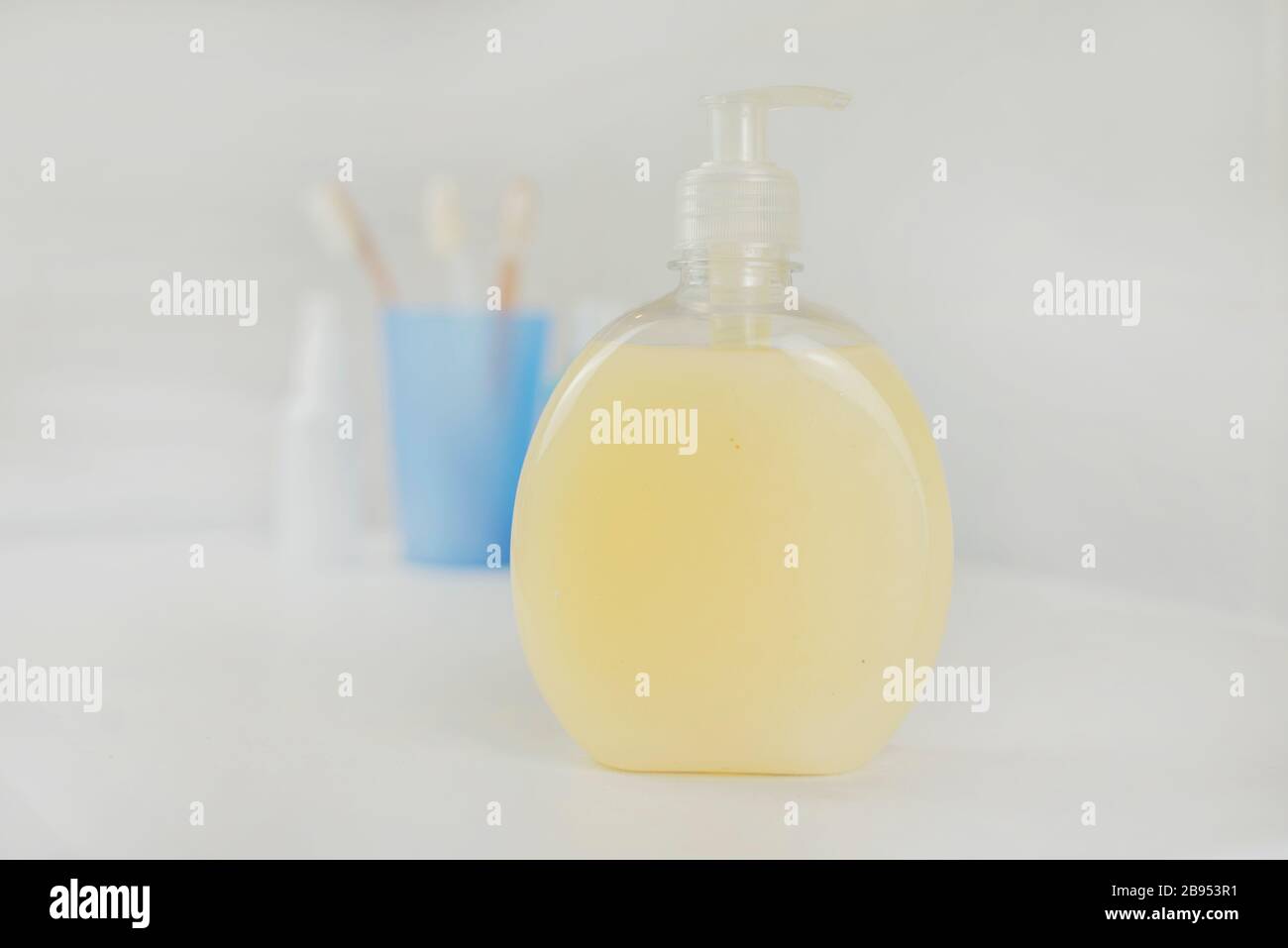 liquid antibacterial protective soap in a bottle with a dispenser in the bathroom Stock Photo