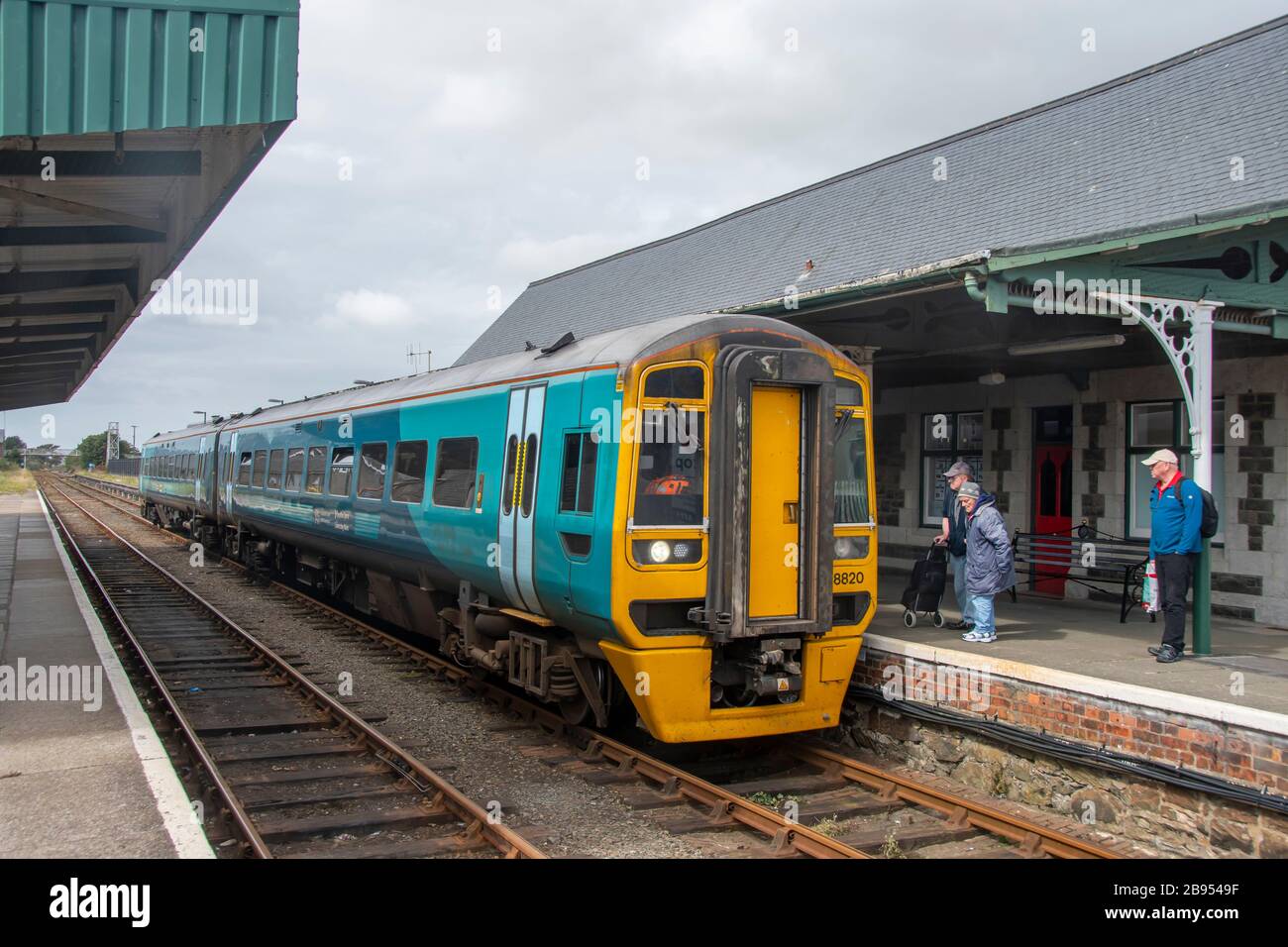 Welsh Government Class 158, Express Sprinter, diesel multiple-unit train arriving at Barmouth station, Barmouth, Gwynedd, Wales Stock Photo