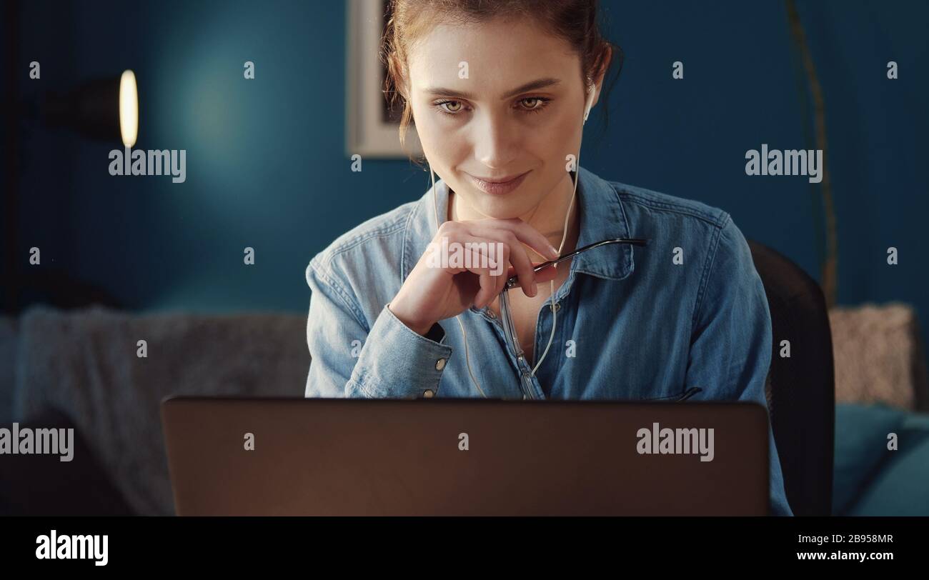 Absorbed woman looking screen Stock Photo