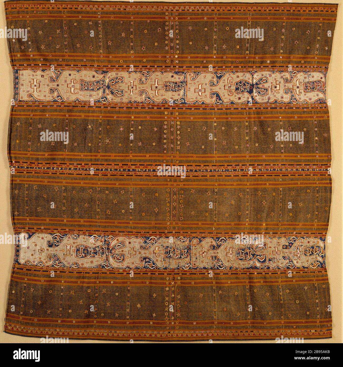 Woman's Ceremonial Skirt (Tapis); English: Indonesia, South Sumatra,  Lampung, Paminggir people, late 19th century Costumes; principal attire  (lower body) Cotton plain weave with resist-dyed warp (ikat), silk  embroidery, mica appliqué 49 1/4