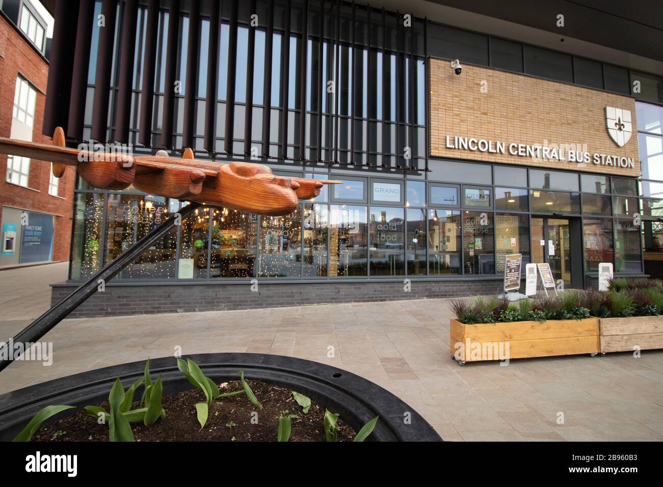 The exterior of Lincoln Bus station and travel hub. In front of the bus station sits a wooden model of a Lancaster bomber plane. The travel hub was completed in 2020. Stock Photo