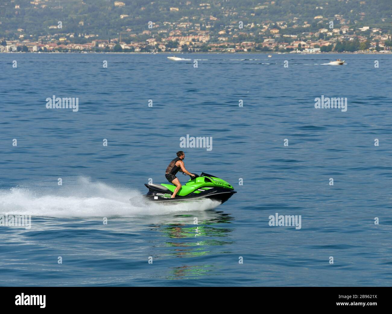 LAKE GARDA, ITALY SEPTEMBER 2018 Person riding a fast jet ski