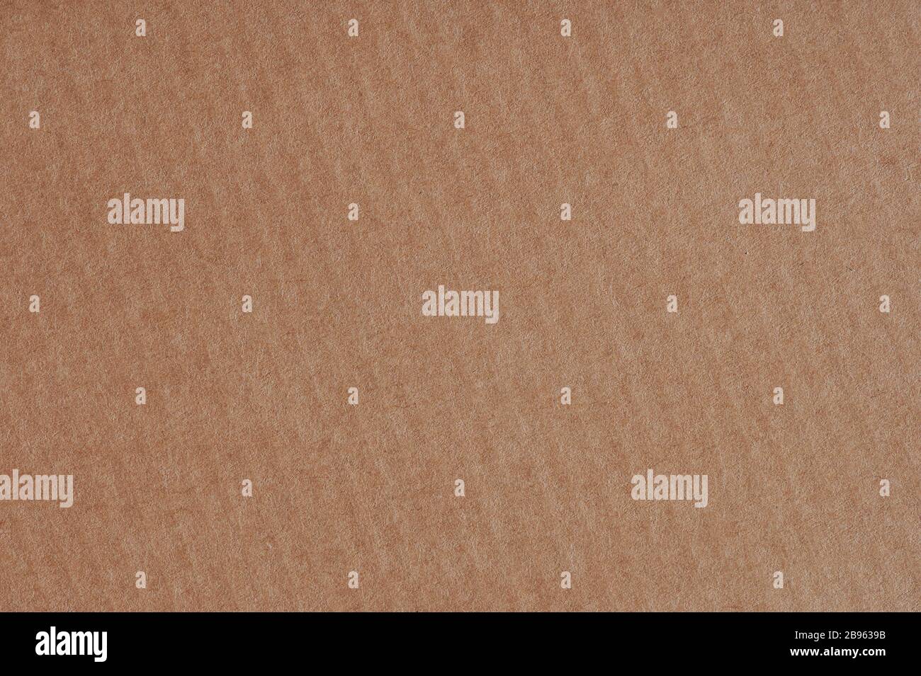 Sheet of brown paper texture background macro close up view Stock Photo