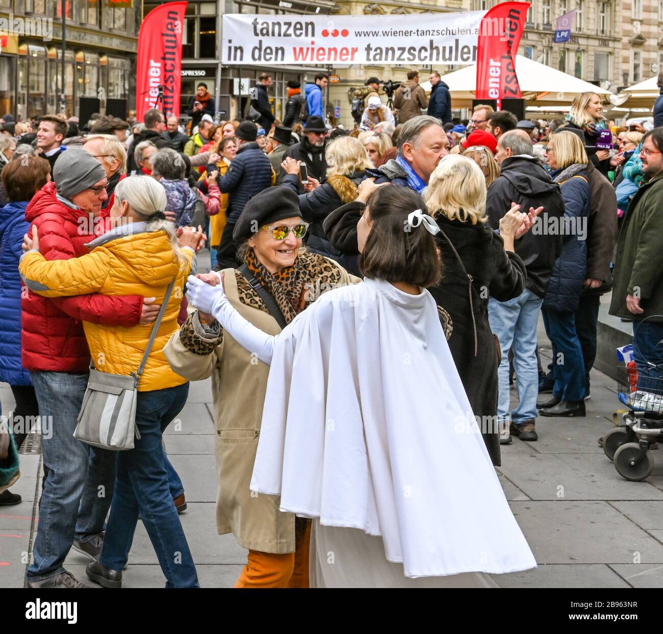 VIENNA, AUSTRIA - NOVEMBER 2019: People dancing the Danube waltz in a public gathering on a street in Vienna city centre. Stock Photo