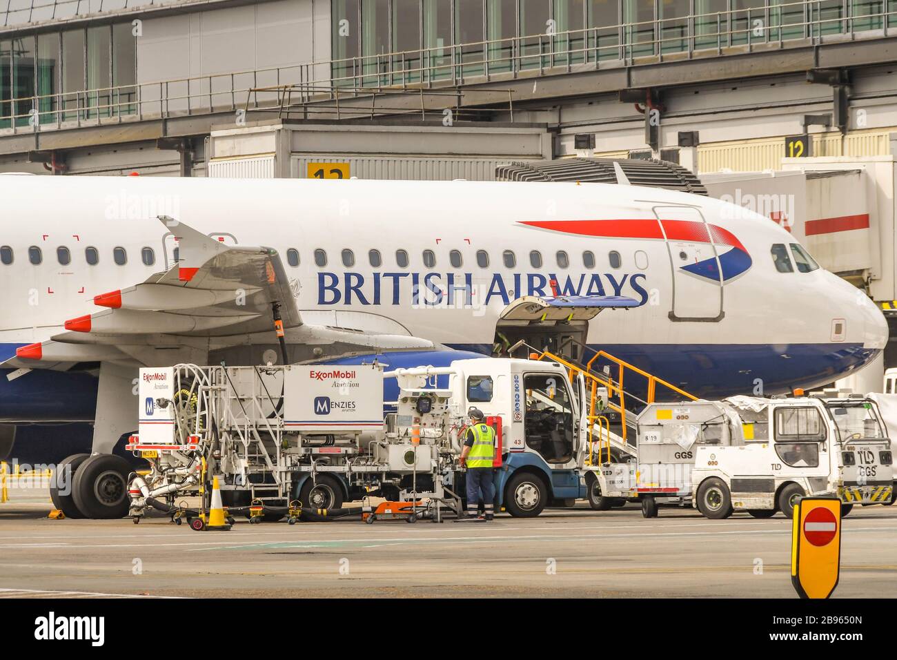 LONDON GATWICK AIRPORT, ENGLAND - APRIL 2019: British Airways Airbus jet being refuelled at London Gatwick Airport Stock Photo